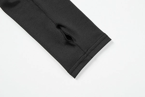 Detail of black long sleeve top showing reinforced thumbholes and high-elastic knit fabric