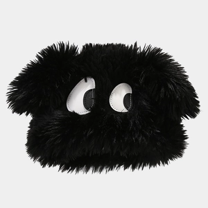 Detail of soft black faux fur winter hat featuring creative cartoon big eye decorations