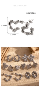 Detail view of heart-shaped steel earring showing 2.34cm height and 2.23cm width dimensions