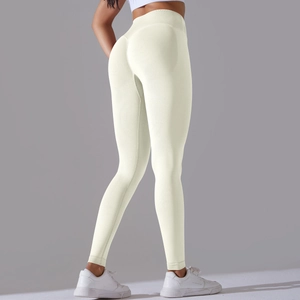 Detail shot of seamless high-waist yoga leggings in off-white with push-up effect
