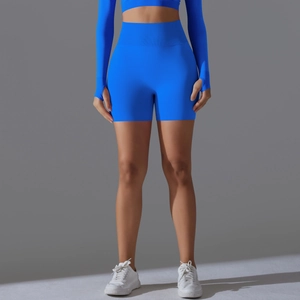 Detailed close-up of high-waisted seamless blue yoga shorts with ribbed waistband