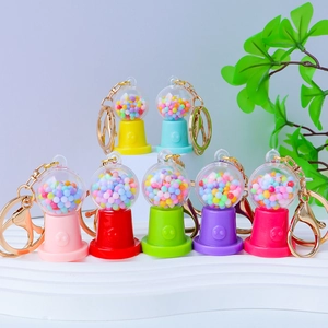 Colorful mini gashapon machine keychains with tiny beads and golden metal rings