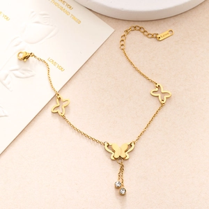 Detailed close-up of double-layered golden stainless steel butterfly chain with small crystals