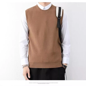 Brown knit vest sleeveless sweater for men paired with a white shirt in a casual style