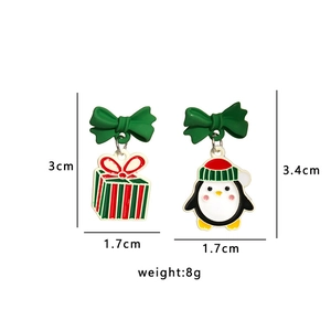 Detailed view of Christmas penguin and gift box earrings with 3cm and 3.4cm size measurements