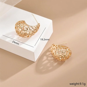 Irregular golden waterdrop earrings with hollow heart pattern in wave curve shape