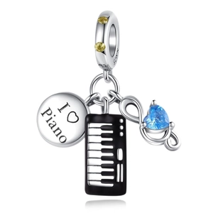 Silver music charm with black piano keyboard, treble clef and heart gemstone pendant