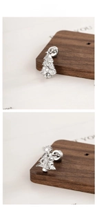 Detail of Christmas tree stud earrings with pave crystals and secure screw-back closure