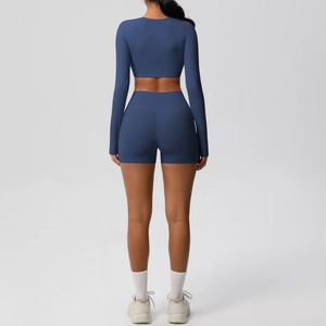 Detail back view of navy yoga set with cropped long sleeve top and high waist shorts