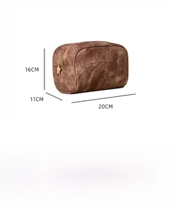 Brown vintage travel toiletry bag showing dimensions 20x11x16cm with gold star zipper