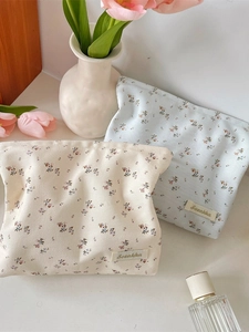 Floral canvas makeup bag set in cream and blue with elegant tulip and perfume styling