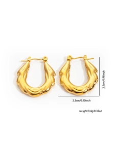 Detail showing irregular wavy texture of golden hoop earrings with size measurements