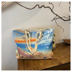 Detailed shot of oil painting style canvas tote bag with thick rope handles and beach print