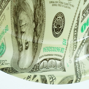 Close-up of high-quality dollar bill print detailing Franklin portrait on party top hat