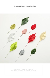 Assorted artificial festive leaves in gold, silver and green for DIY Christmas wreaths
