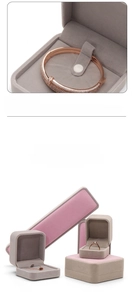Detailed macro view of grey and pink velvet jewelry boxes for rings and necklaces