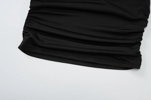 Detail of ruched side seams and double-needle hem on black slim fit summer T-shirt