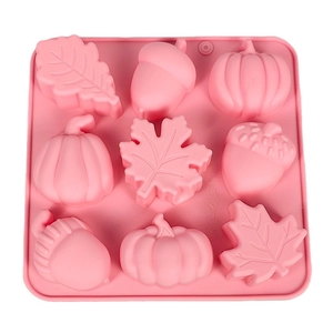 Pink 9-cavity silicone mold featuring pumpkin acorn and maple leaf shapes for DIY crafts