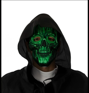 Front view of glow-in-the-dark green skull mask with black hood for Halloween party