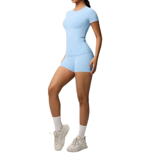 Slim fit light blue athletic yoga set featuring short sleeve t-shirt and high waist shorts