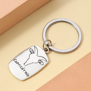 Detailed macro view of vintage silver Capricorn zodiac alloy keychain with goat emblem
