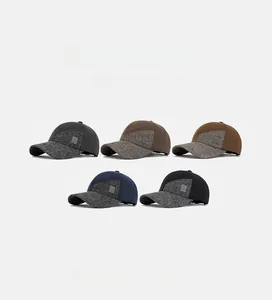 Detail showing various colors of men's winter baseball caps with earflaps and soft crown