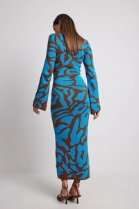Back view of a long-sleeved knitted dress with blue and brown leopard animal print pattern