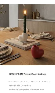 Detailed view of heart-shaped ceramic candle holders in white matte and red glossy finish