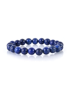 Macro shot of natural lapis lazuli beaded bracelet with deep blue color and gold pyrite spots