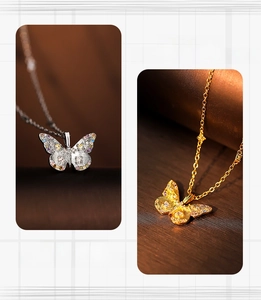 Detail of butterfly pendants with colorful zircon inlay and brushed metallic texture