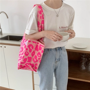 Detailed close-up of pink leopard print tote bag with soft knitted texture for women