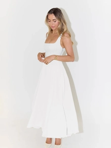 Detail showing the square neckline and elegant A-line silhouette of the white midi dress