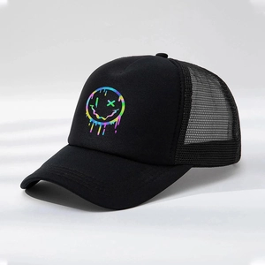 Close-up detail of the rainbow fluid smiley face print on a black trucker hat