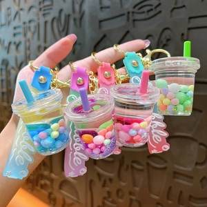 Cute bubble tea cup keychain with liquid quicksand and colorful beads for bags