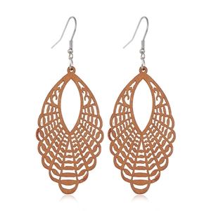 Detail shot of hollow teardrop wooden earrings with natural grain and metal hooks