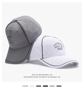 Detail of embroidered grey and white baseball caps with water-resistant fabric texture