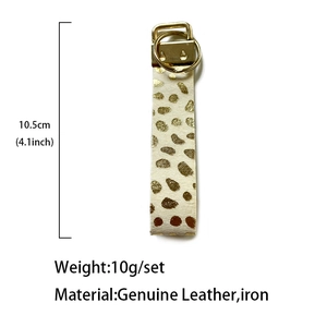 Portachiavi in vera pelle a pois dorati con anello in metallo, lungo 10,5 cm