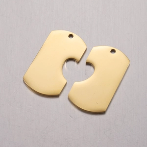 Close-up of interlocking heart puzzle pendants in polished gold finish for DIY keychains