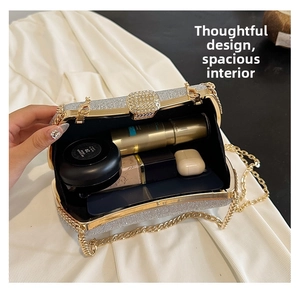 Detailed interior of a silver sequin evening clutch showing space for a phone and makeup