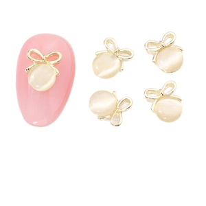 Bijoux à ongles nœud doré avec pierre œil de chat pour une décoration manucure 3D chic
