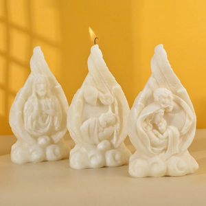 Religious themed feather candles with relief engravings and soy wax drip flame design