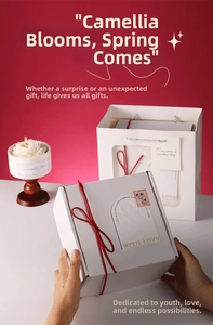 Elegant Valentine gift set featuring a camellia scented candle with ribbon gift box and bag