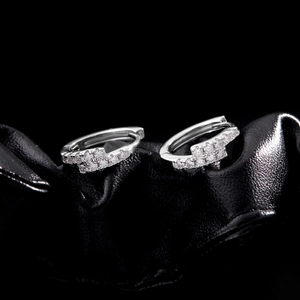 Sparkling D-color moissanite hoop earrings in 925 sterling silver on black leather