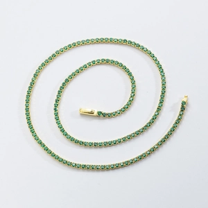 Elegant gold tennis necklace with round green emerald-style cubic zirconia stones