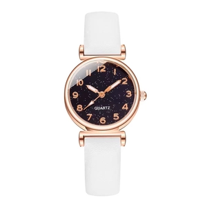 Detailed view of women quartz watch featuring a starry sky dial and white leather strap