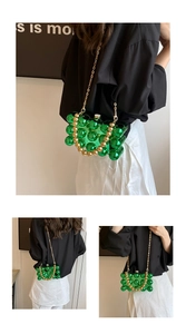 Close-up of emerald green bubble acrylic handbag with gold chain and beaded handle