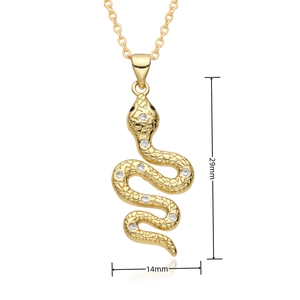 Detailed view of gold snake pendant with micro-pave crystals measuring 29mm by 14mm