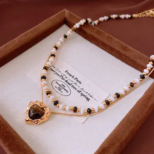 French vintage double-layered beaded necklace with heart-shaped tiger eye pendant in gold