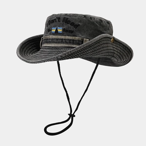 Detailed embroidery and metal eyelets on dark grey vintage canvas western bucket hat