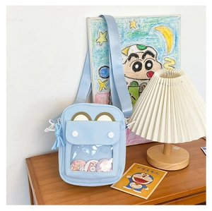 Detail view of the light blue PU ita bag showing transparent display window and cute ears